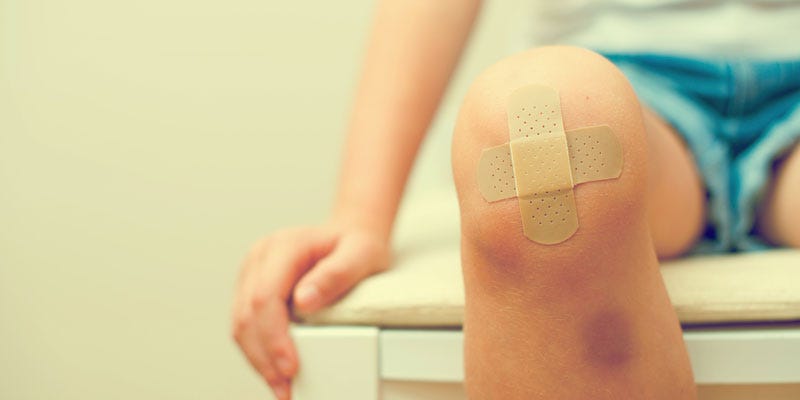 Boy with bandaid on knee
